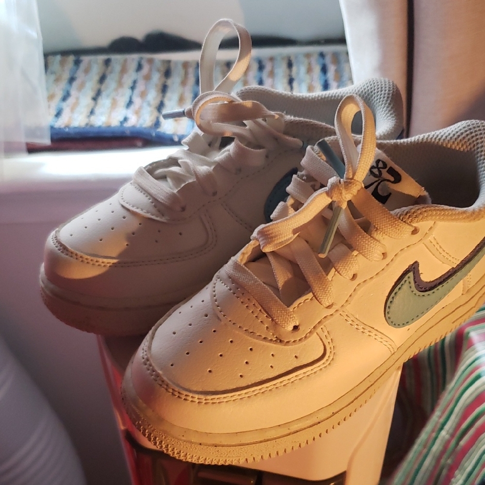 White Sneakers with Blue Swoosh